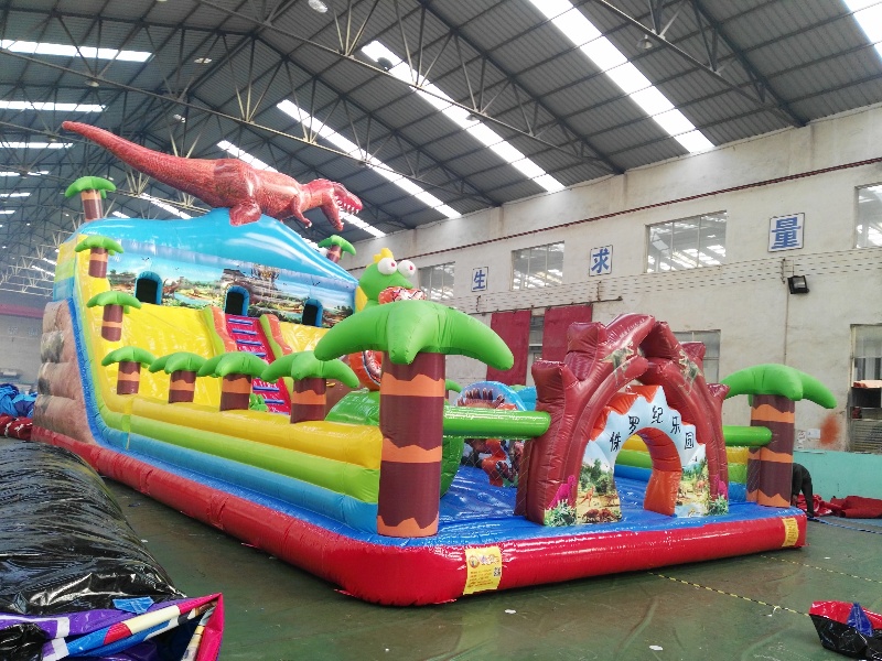 Inflatable dinosaur castle with slide